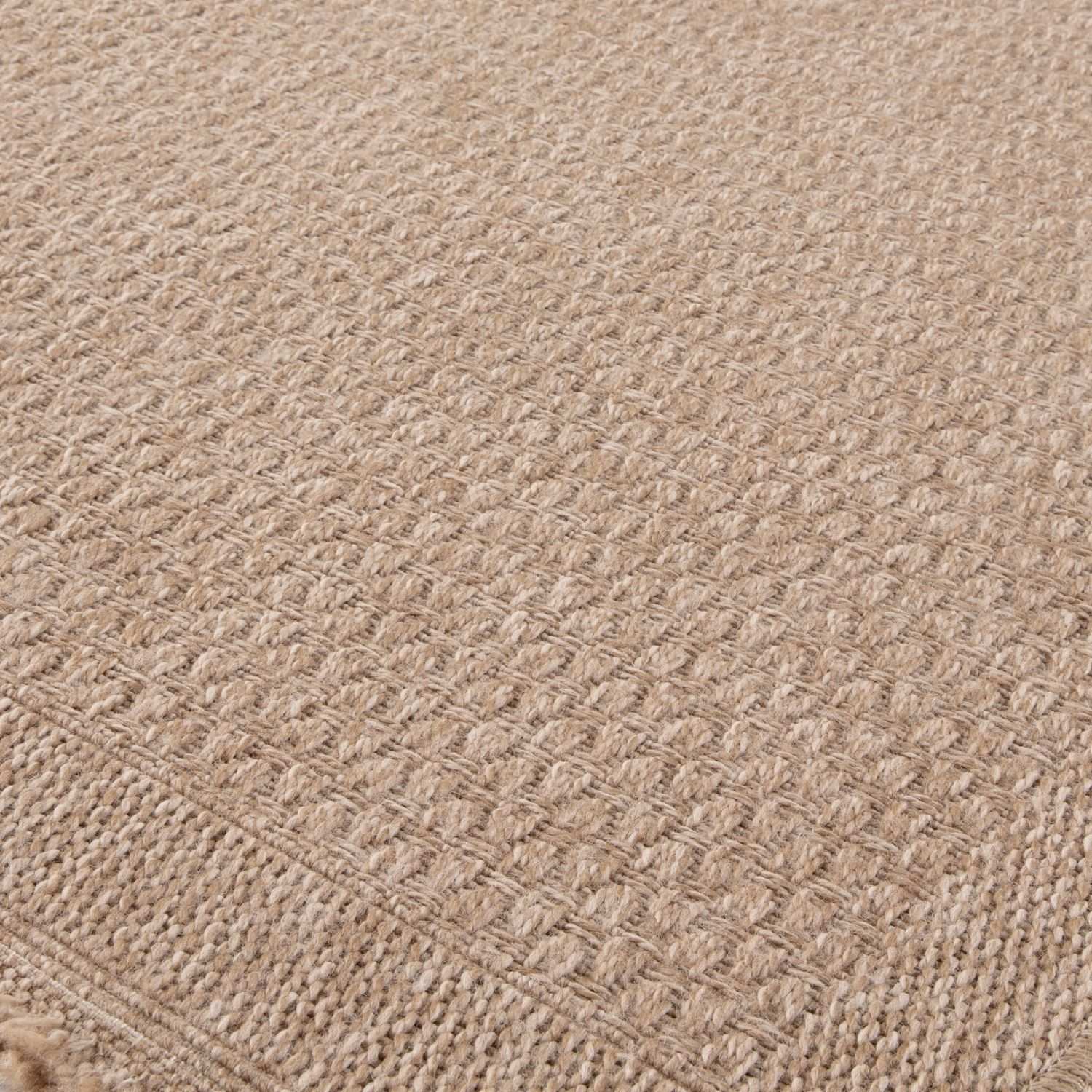 Neutral outdoor rug by The Rugs featuring natural tones, textured design, and durable material suitable for outdoor spaces.