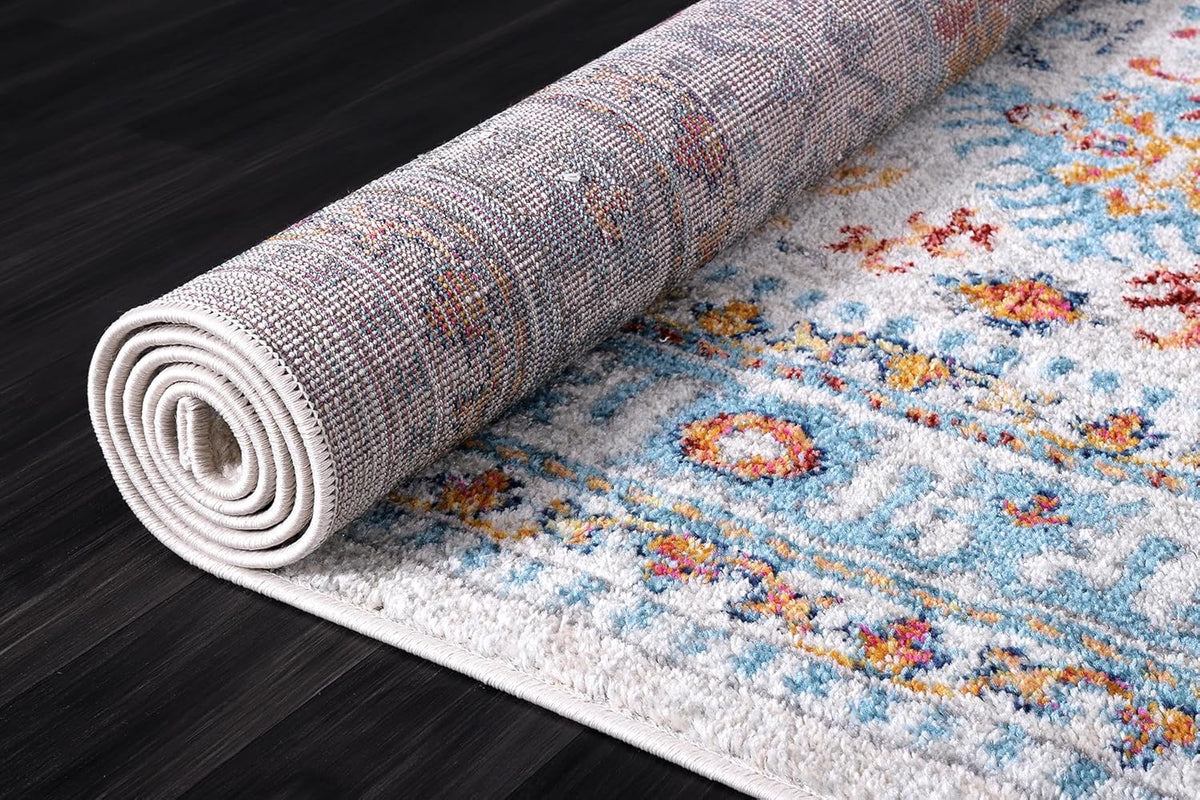 Cream and blue oriental rug with traditional vintage design, soft medium pile, stain-resistant, suitable for living room, bedroom, or dining.