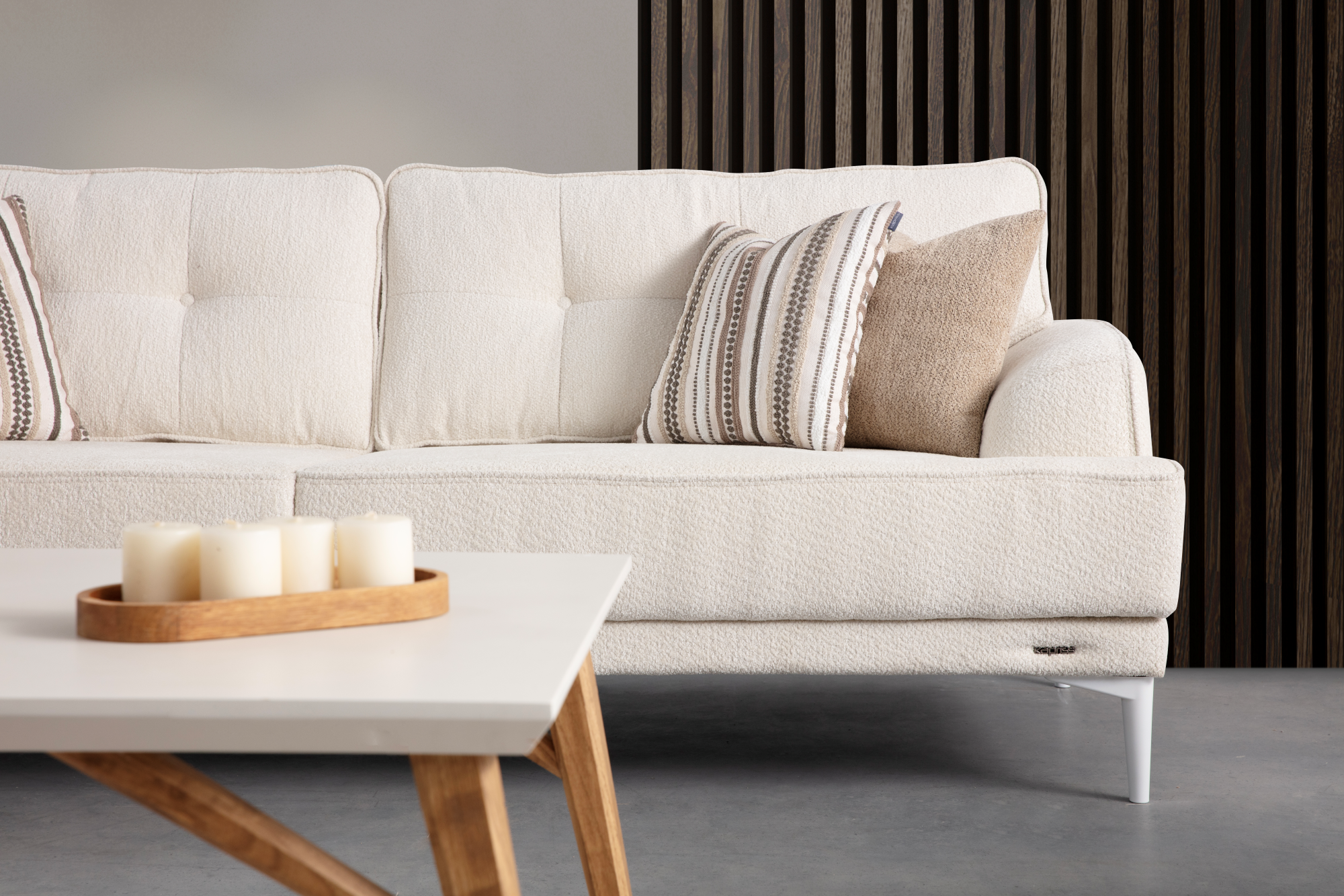 Netline Home Interior Sonya 2 Seater Sofa in a modern living room setting, featuring a compact design with plush cushions and stylish fabric.