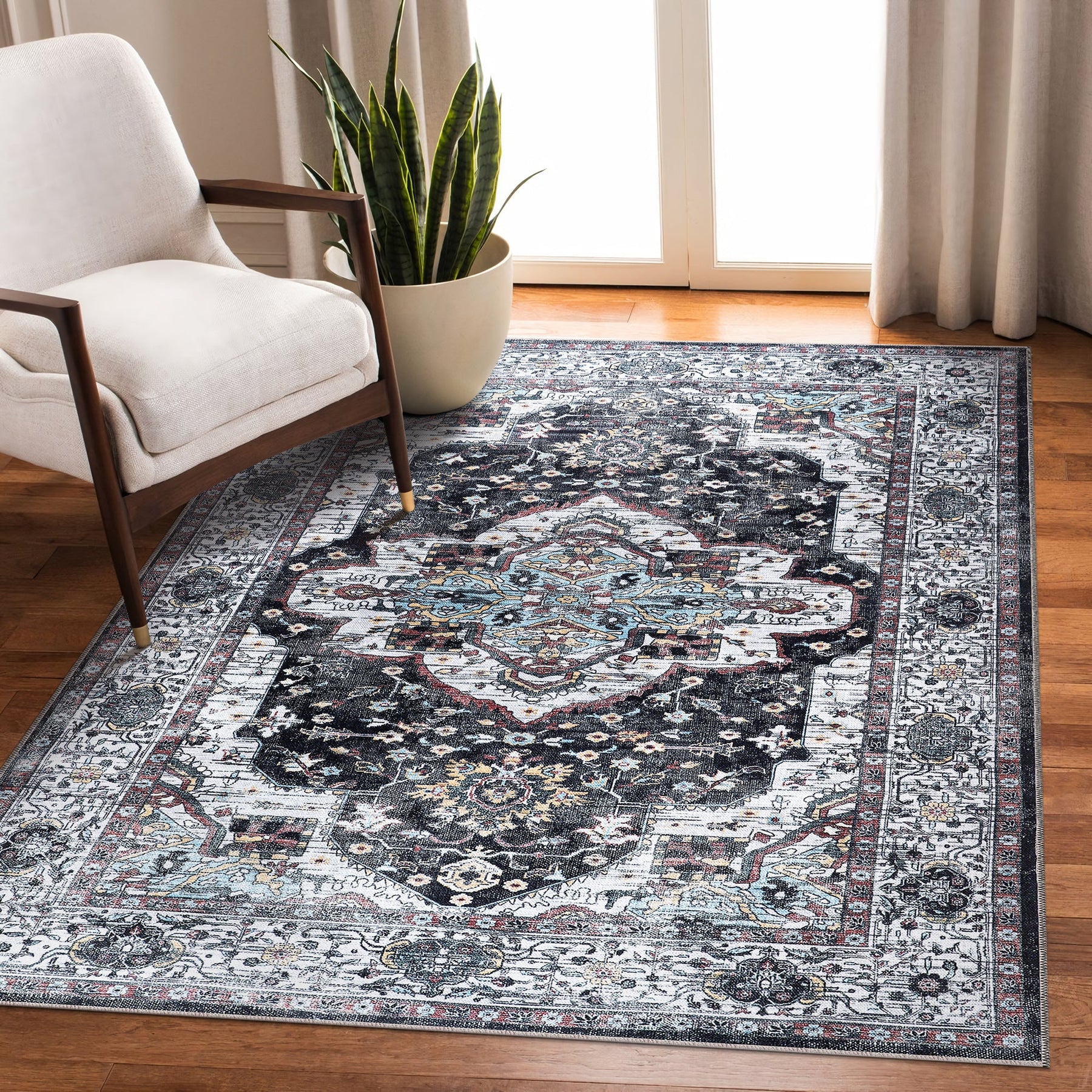 Machine washable Persian medallion rug by Netline Home featuring vintage black, white, and blue accents, ideal for living and dining rooms.