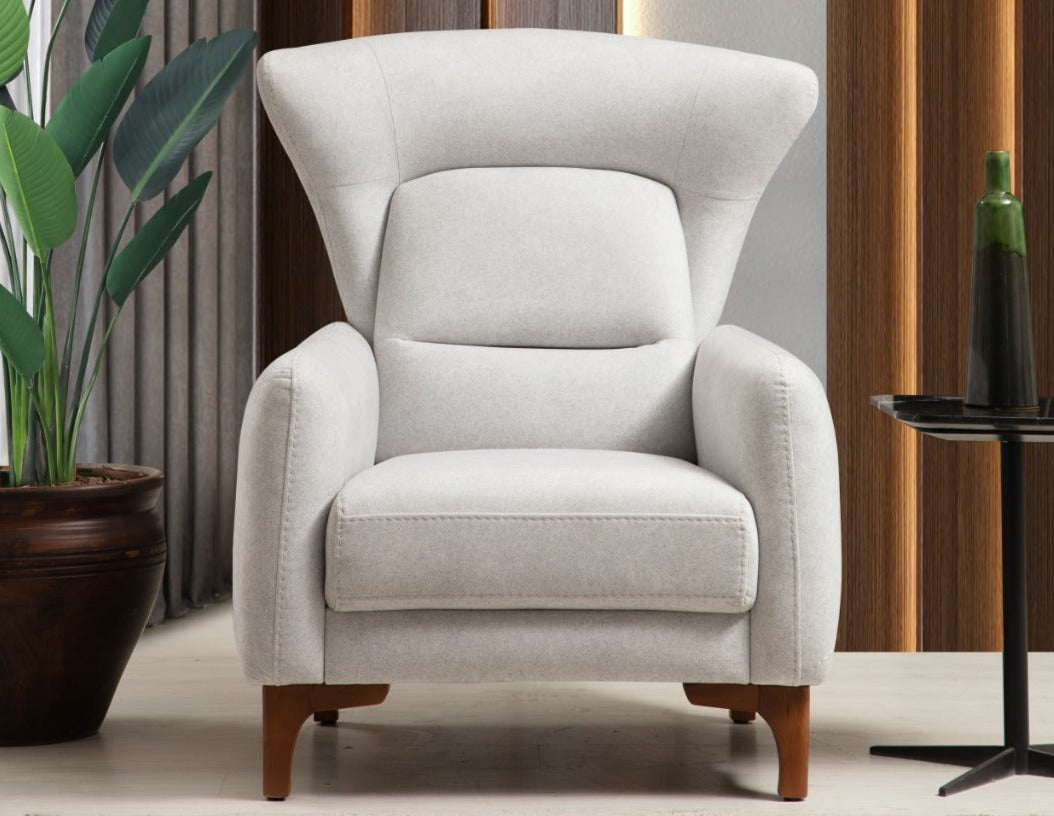 Netline Home Interior Oscar armchair with plush fabric upholstery and modern design, ideal for comfortable accent seating.