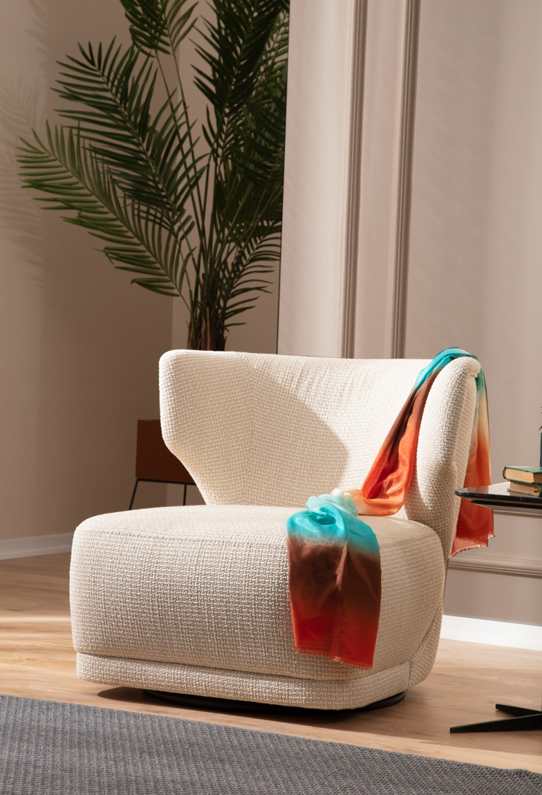 Netline Home Interior Aoria armchair with plush cushions, stylish design, and wooden legs for comfortable accent seating.