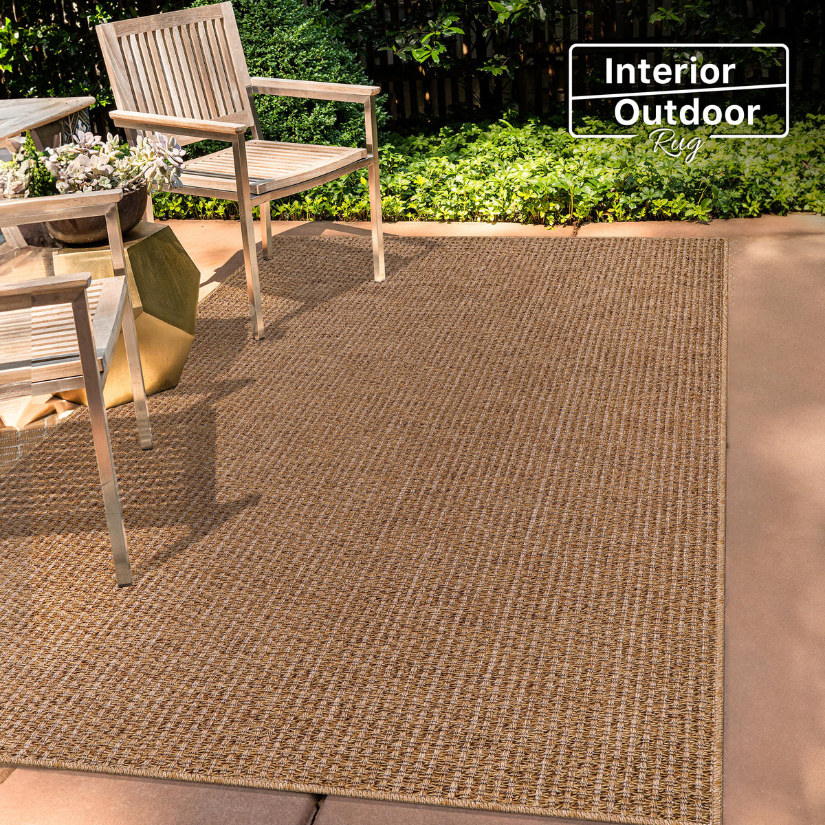 Netline Home woven jute-effect outdoor rug with basket weave texture, washable, weatherproof, non-slip backing for indoor and outdoor use.