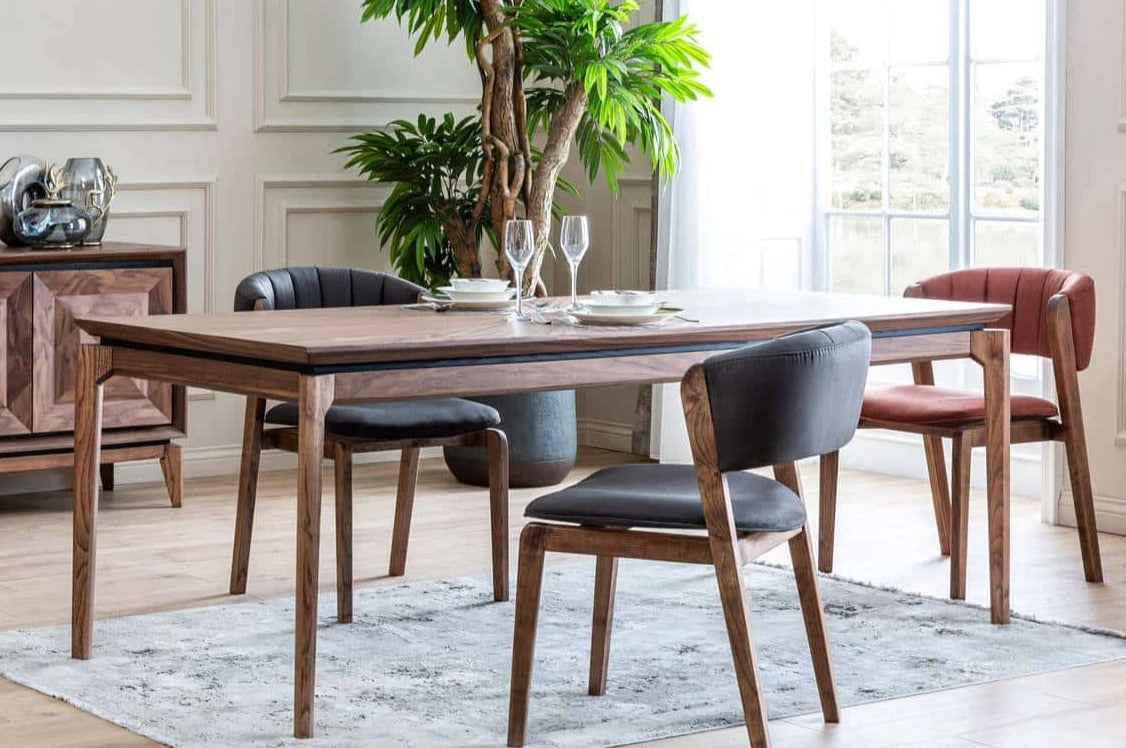 Maserati dining table with matching chairs in a modern dining room, featuring sleek design and stylish home interior decor.
