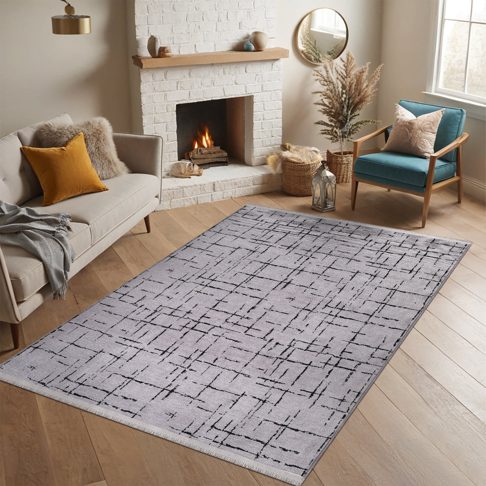 Machine washable gray chenille rug by Netline Home, soft and plush with a textured surface, suitable for modern living spaces.