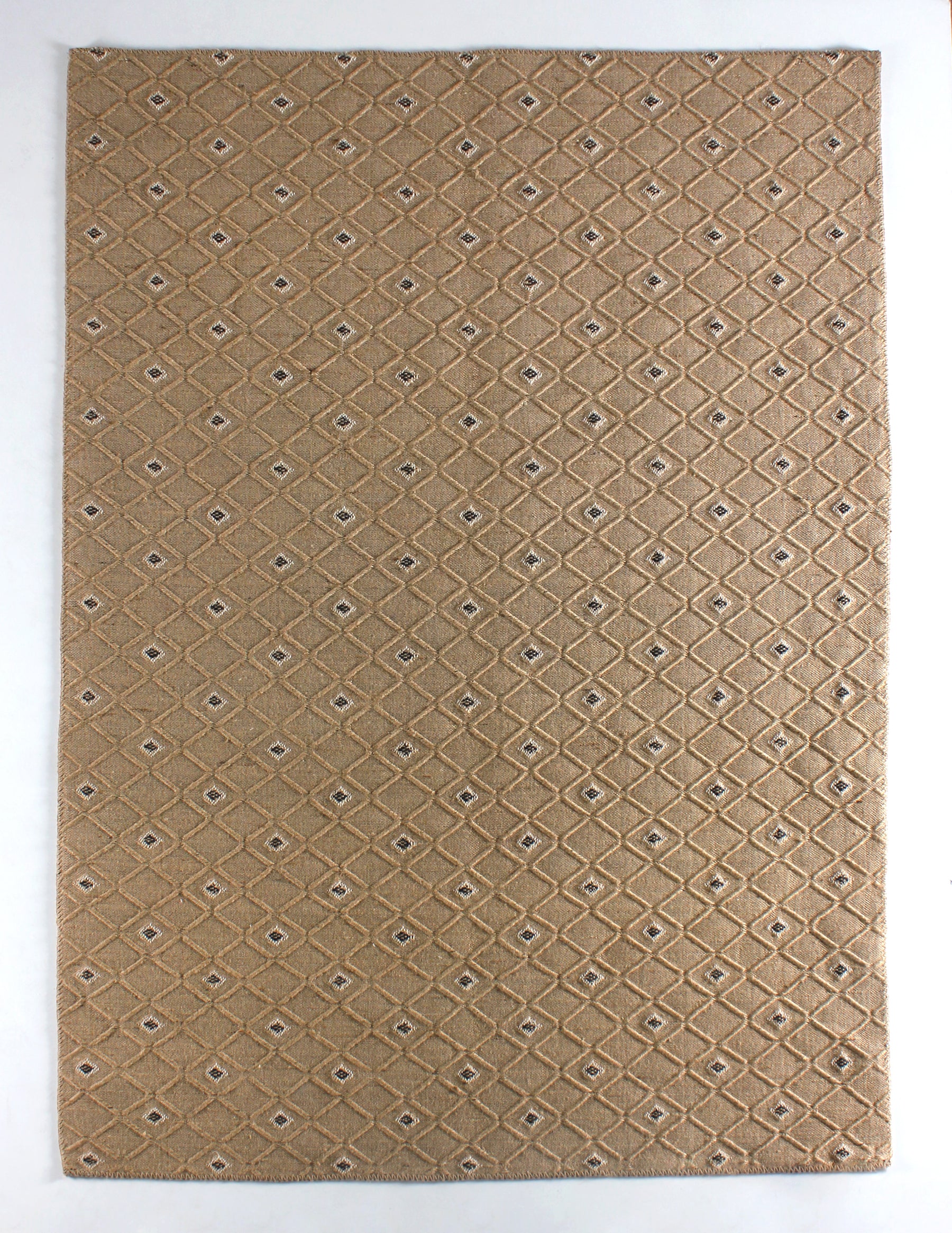 Natural jute geometric washable rug by Netline Home with beige and black patterns, featuring a flatweave design and cotton backing.