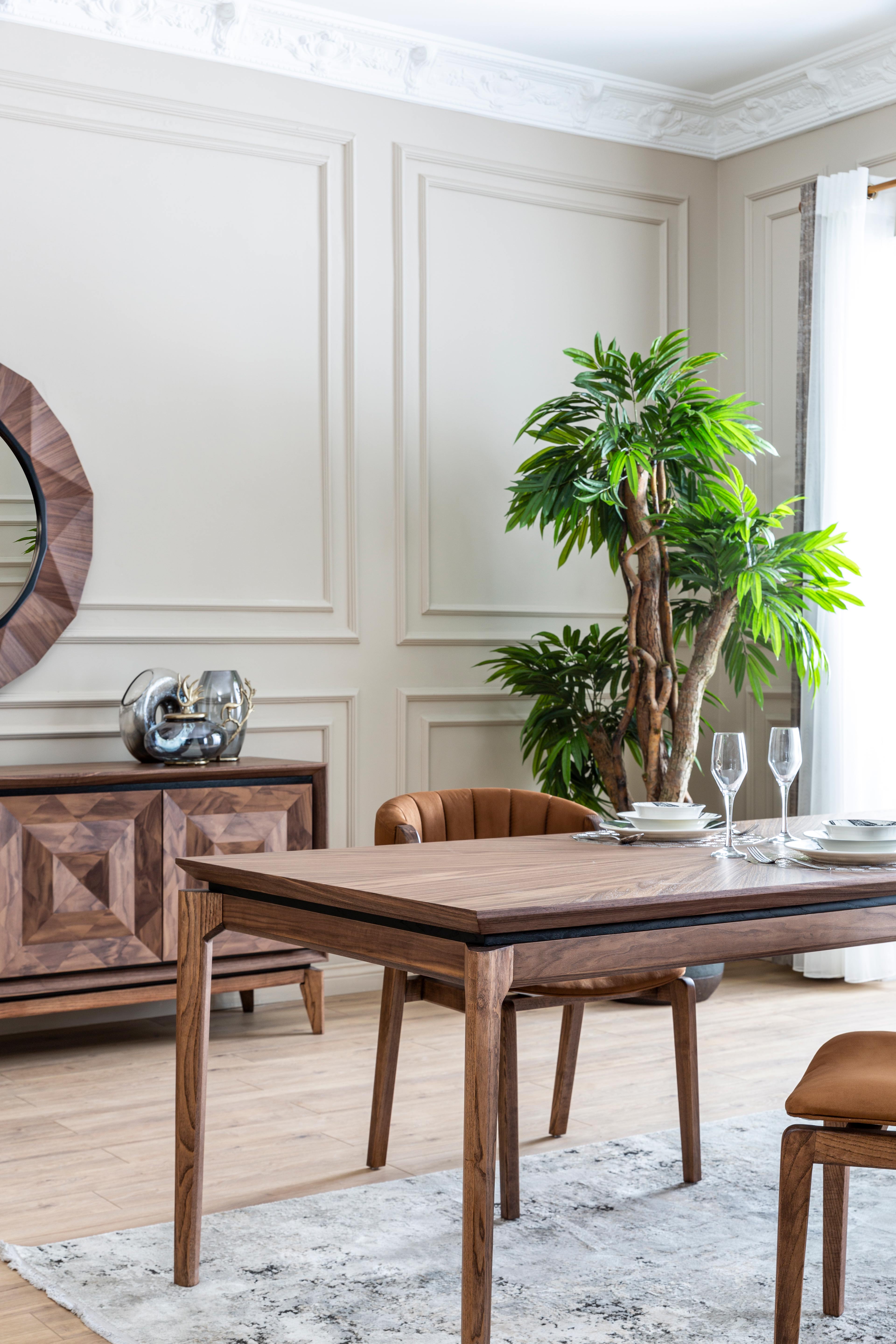 Modern Maserati dining table by Netline Home Interior, showcasing sleek design and sturdy table top for contemporary dining rooms.