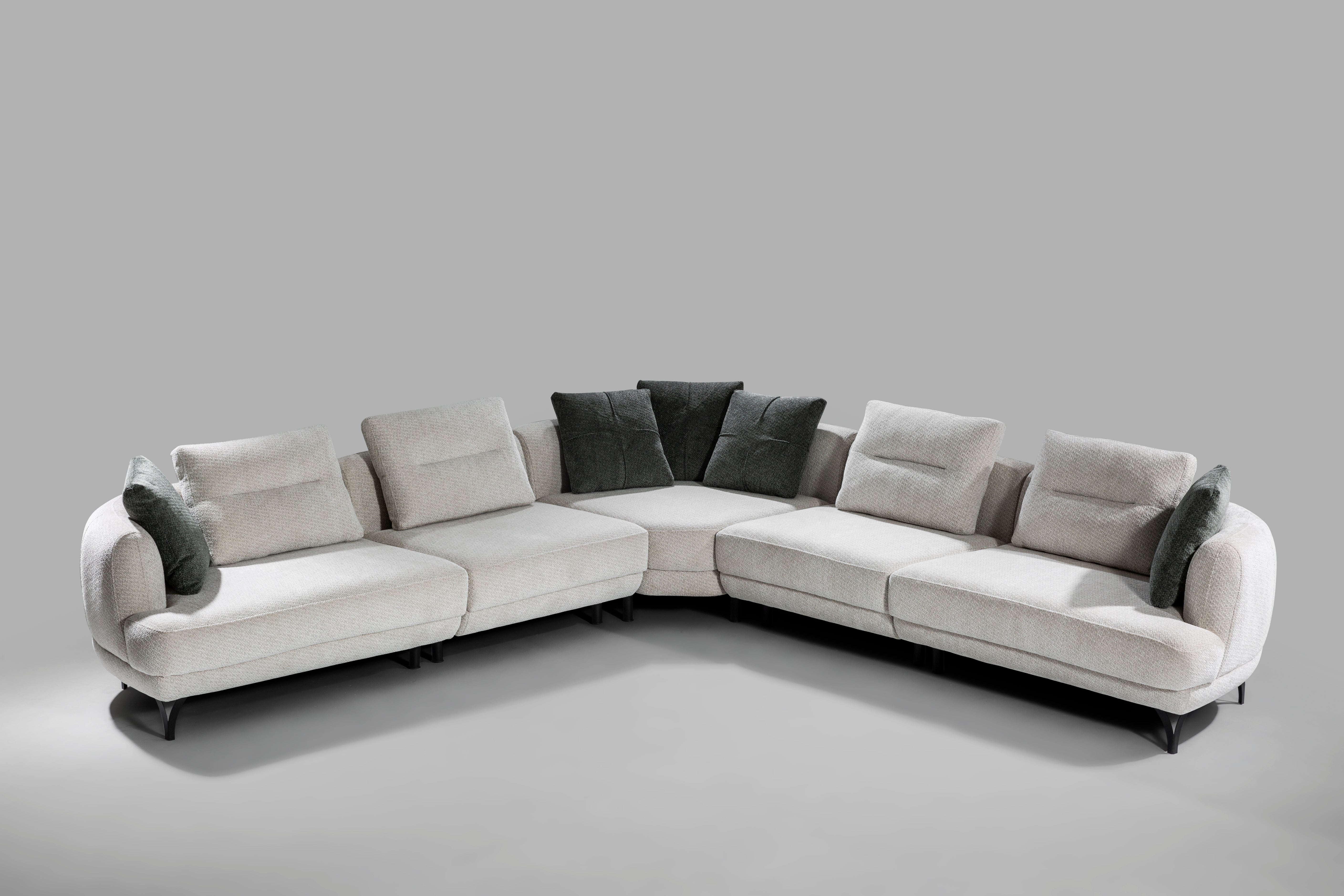 Oslo Corner Sofa by Netline Home Interior in a spacious lounge setting, showing plush cushions and modern corner design.