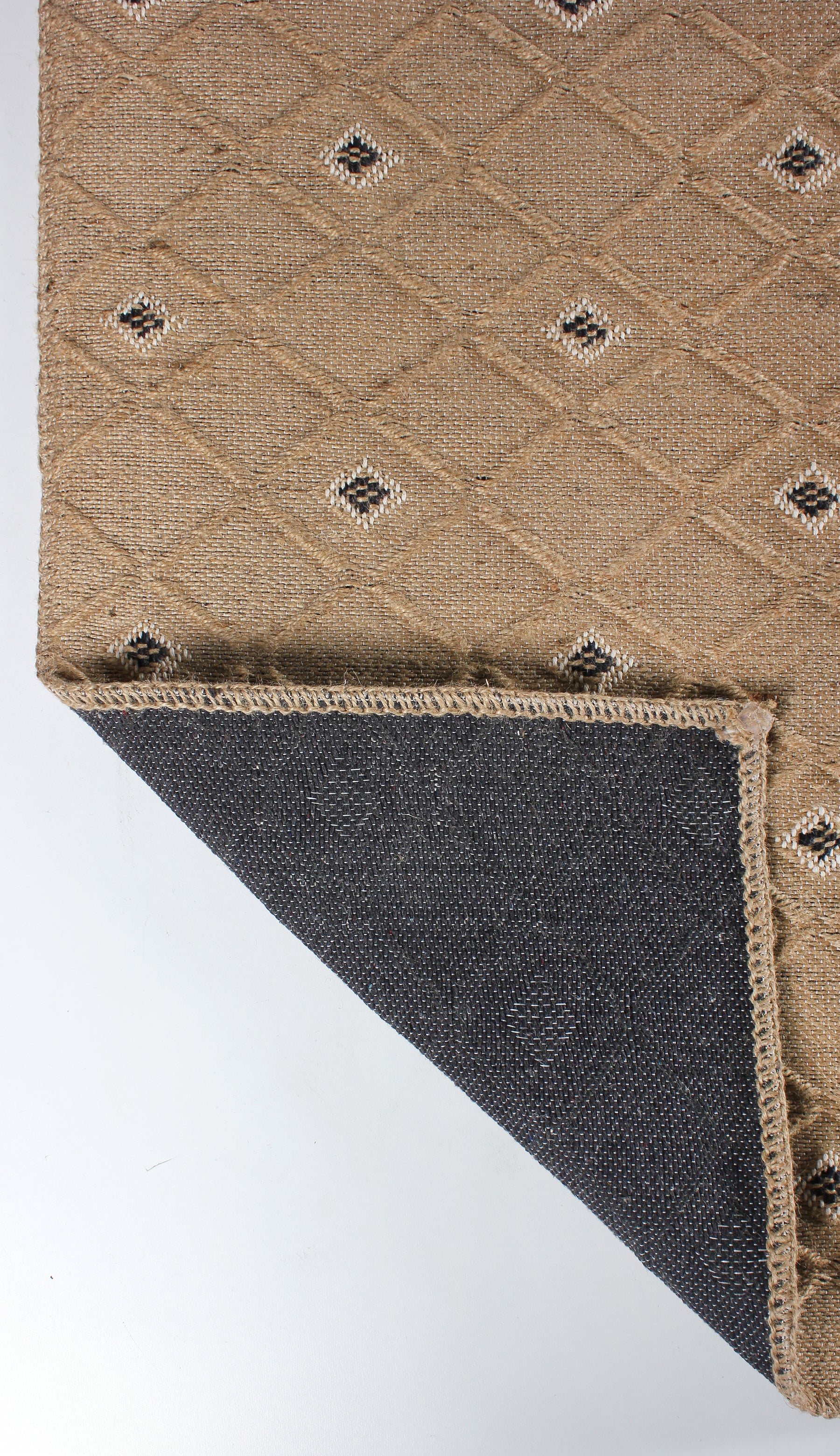 Natural jute geometric washable rug by Netline Home featuring beige and black pattern with cotton backing, eco-friendly flatweave design.