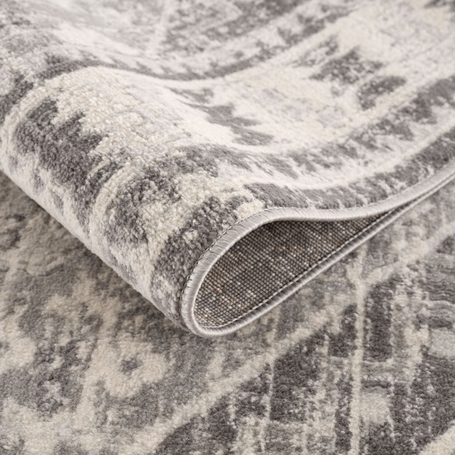 Montana Oriental Grey Rug by The Rugs, showcasing intricate grey and beige patterns on a plush, decorative rug for living spaces.