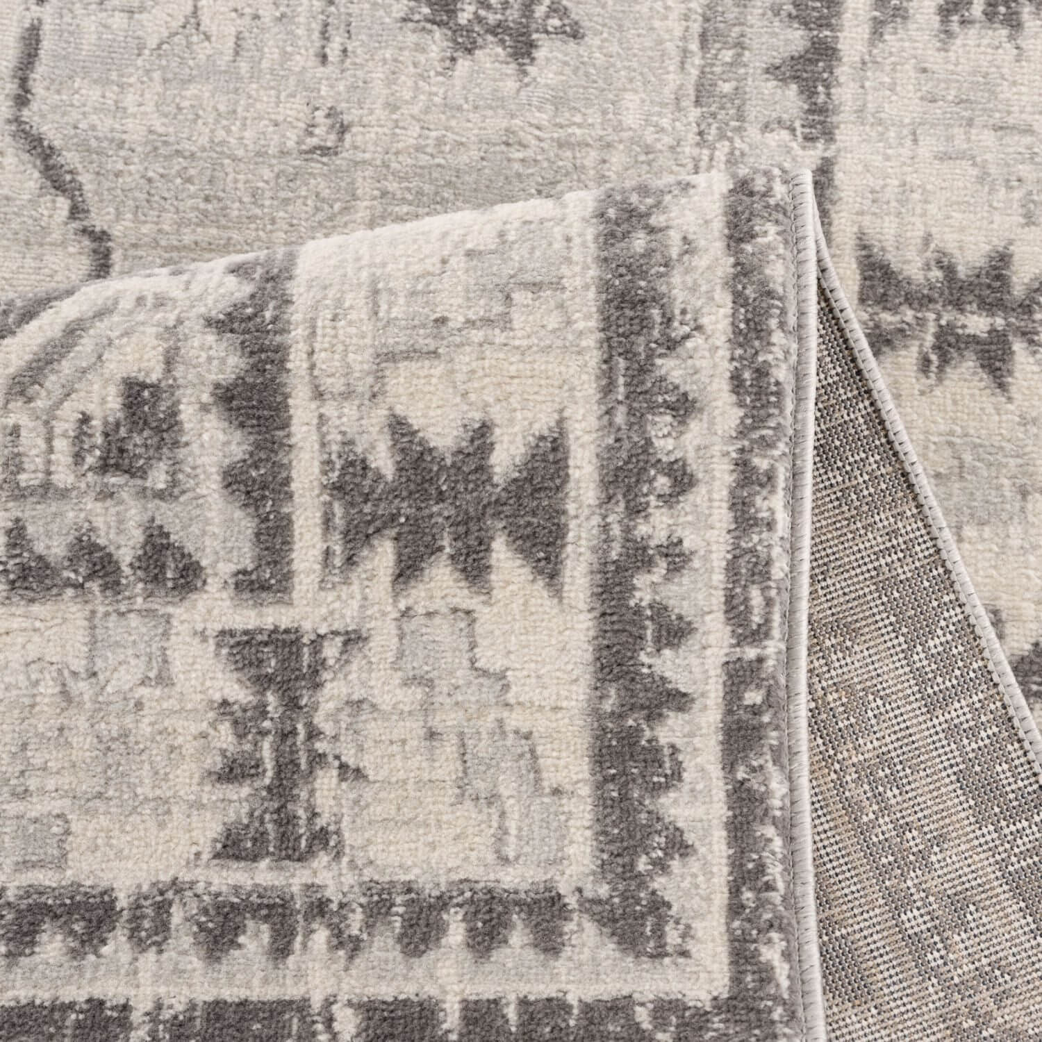 Montana Oriental Grey Rug by The Rugs featuring a medallion design and intricate patterns in shades of grey.