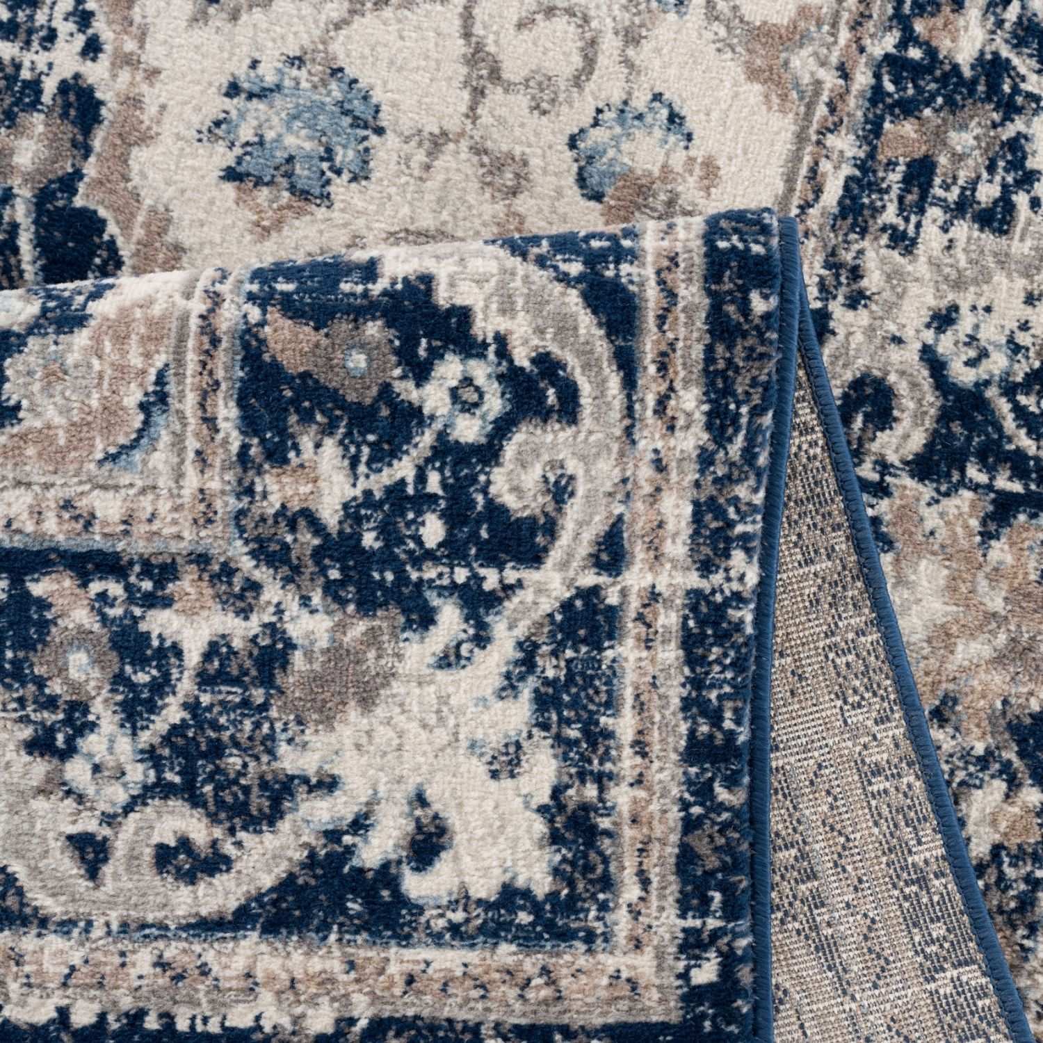 Montana Oriental Blue Rug by The Rugs, detailed close-up showing intricate blue and beige pattern and soft woven texture.