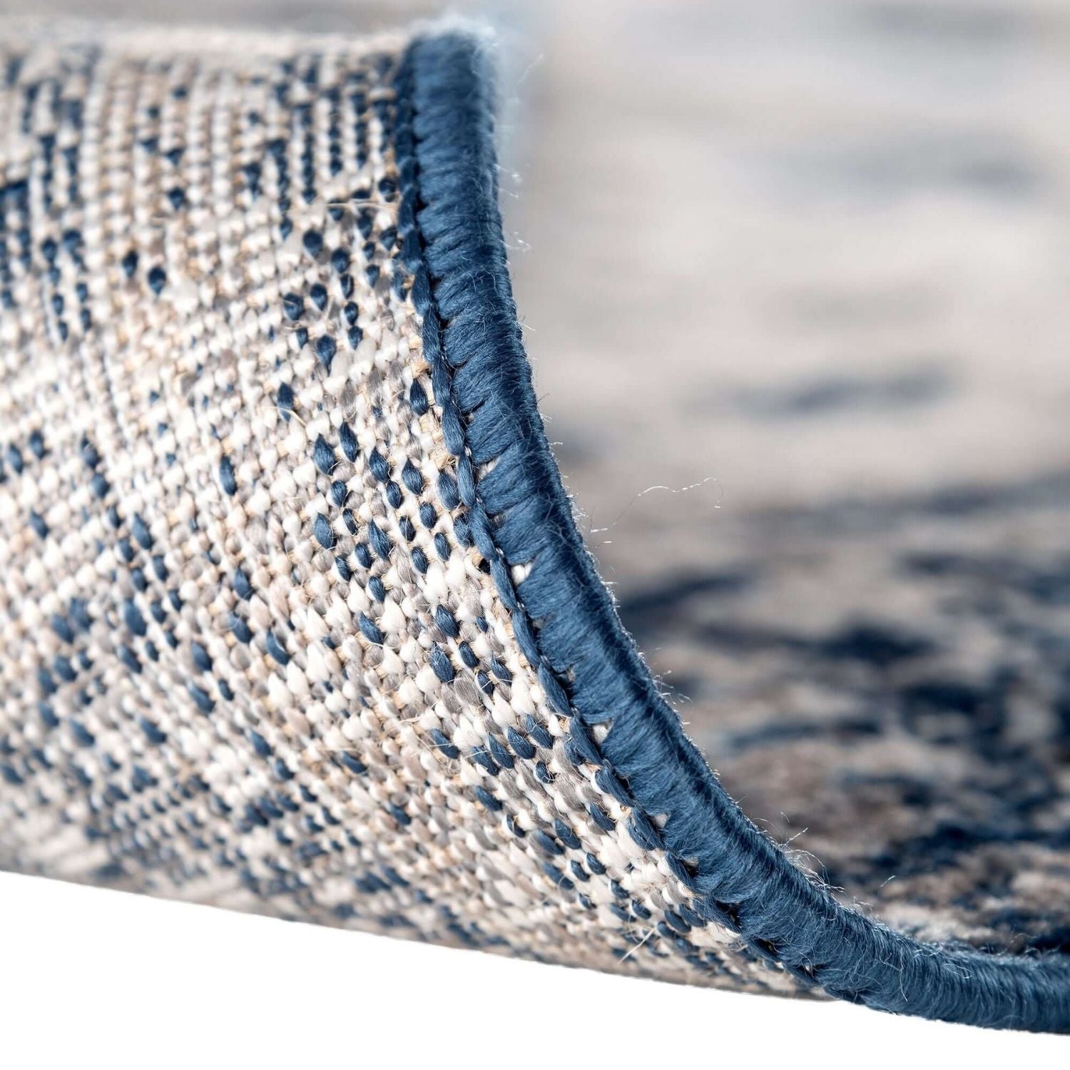Montana Oriental Blue Rug by The Rugs, featuring intricate blue and beige patterns, woven textile floor covering.