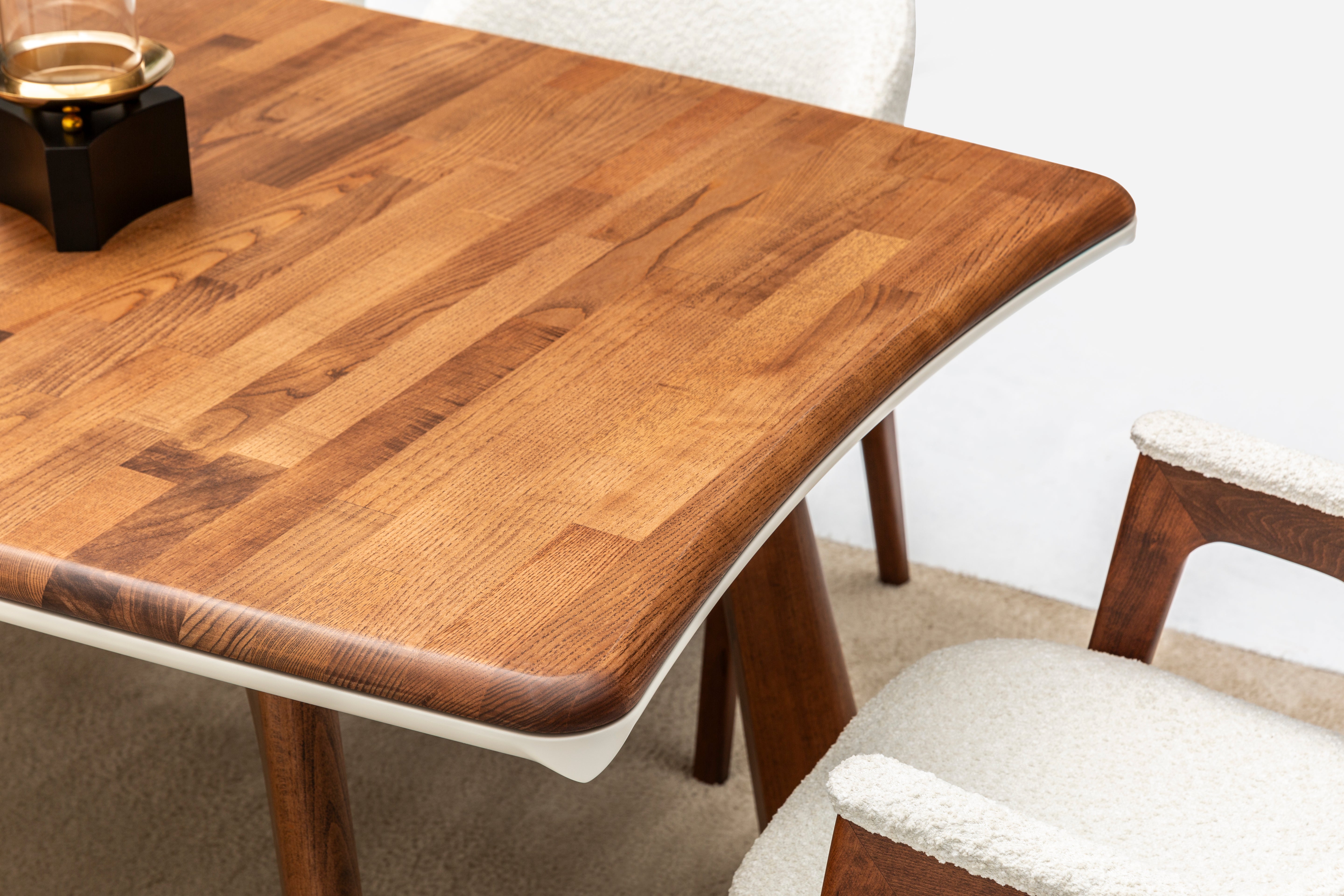 Modern Corvette dining table by Netline Home Interior, showcasing a sleek, rectangular table with a smooth wooden finish.