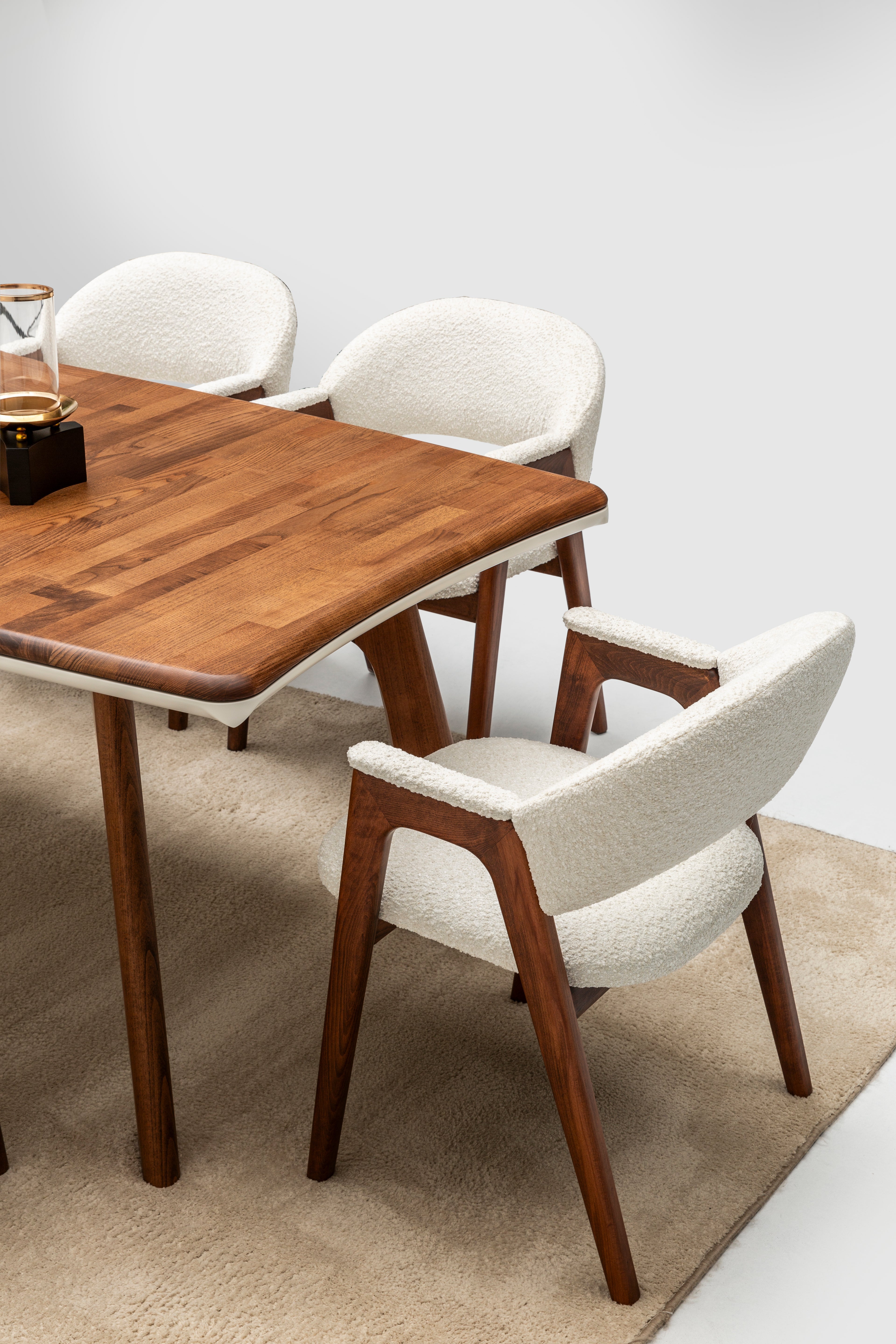 Corvette dining table with four matching chairs from Netline Home Interior, stylish family dining set in a modern room setting.
