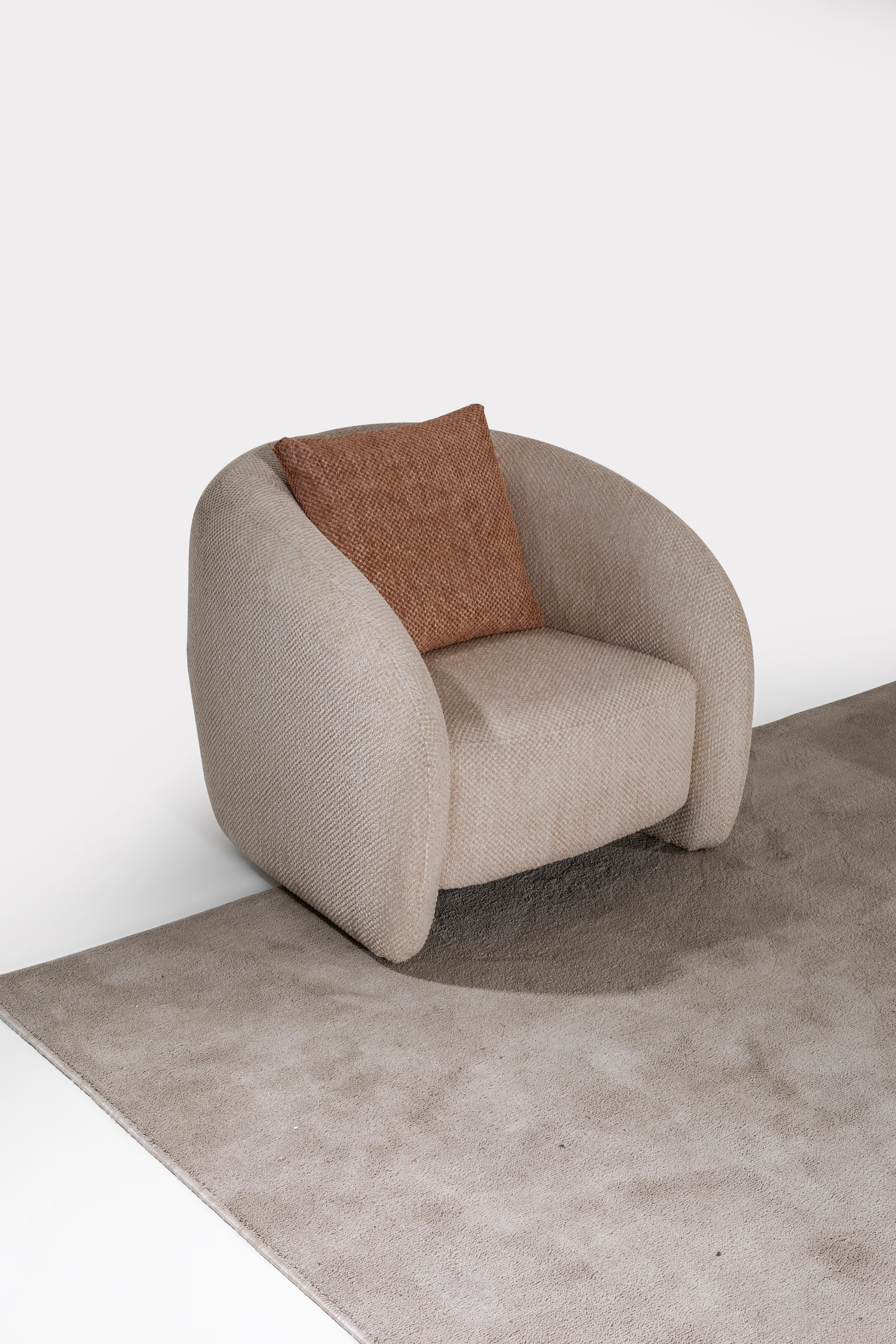 Netline Home Interior Lincoln armchair with plush fabric upholstery, modern design, and comfortable accent seating for living rooms.