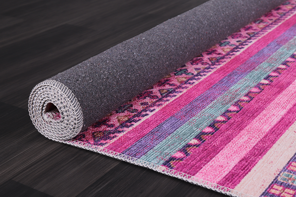 Bohemian pink striped washable rug by Netline Home with vibrant pink and white stripes, soft and durable for home decor.
