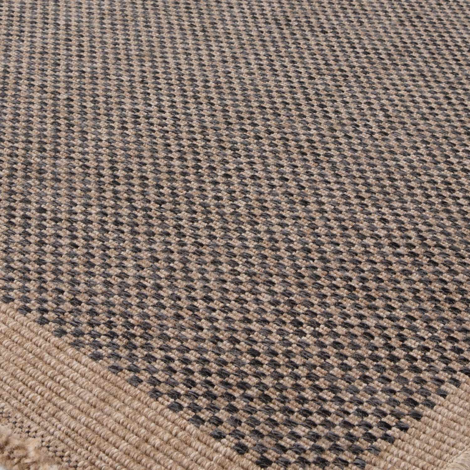 Dark grey outdoor rug from The Rugs' Nature series, featuring a textured design suitable for patios and outdoor spaces.
