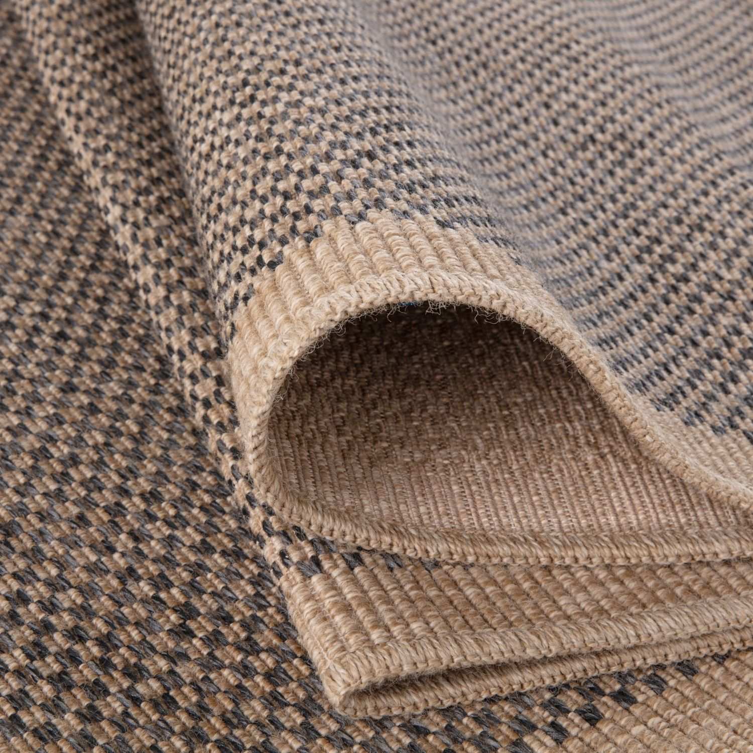 Dark grey outdoor rug from The Rugs, Nature series, showcasing a textured, weather-resistant design suitable for outdoor spaces.