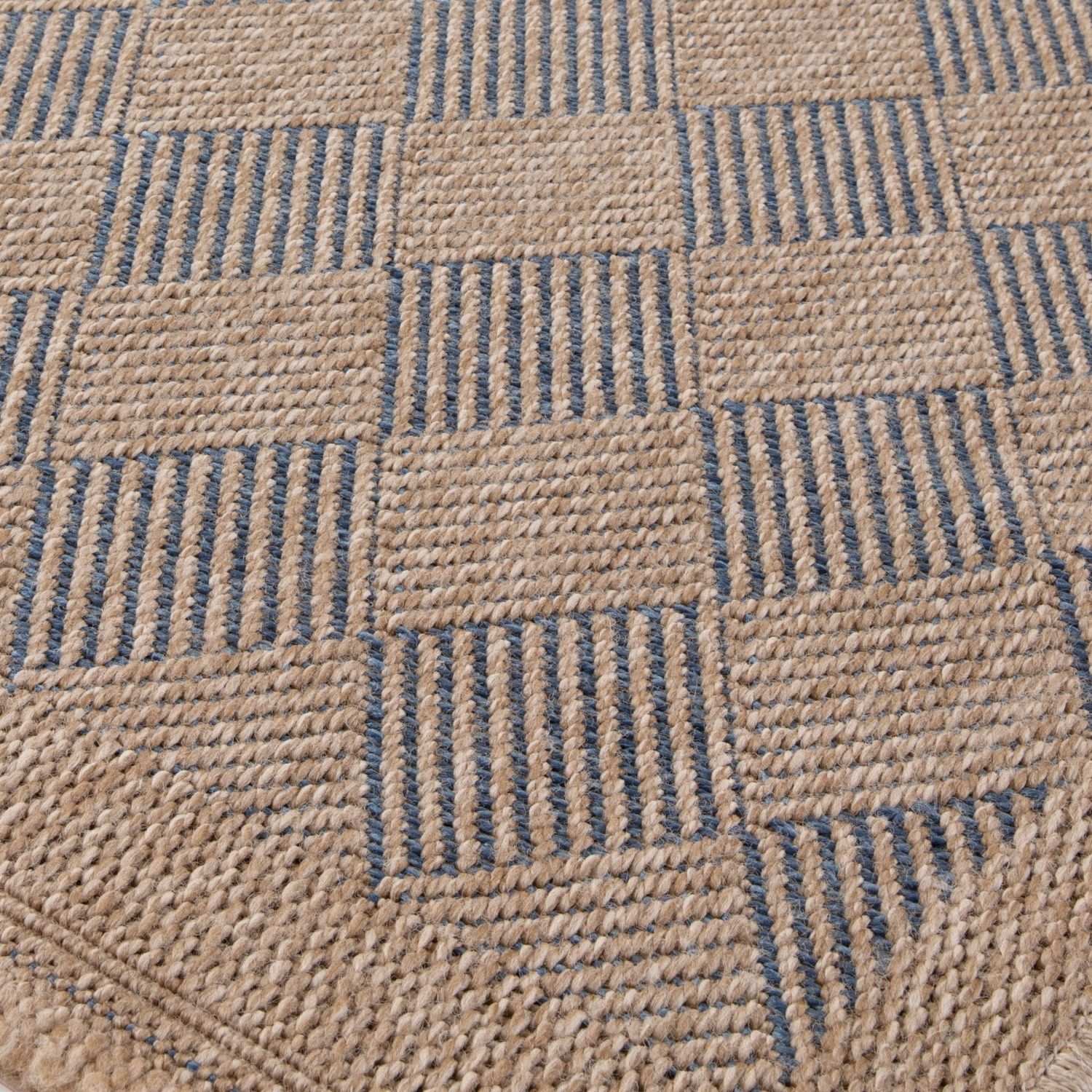 Blue outdoor rug from The Rugs, Nature series, featuring a textured pattern suitable for patios and outdoor spaces.