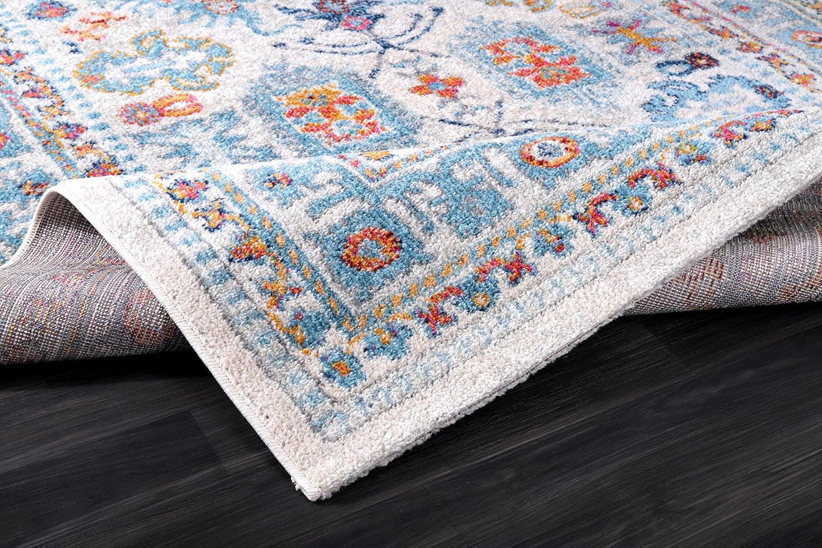 Cream and blue oriental-style rug with vintage design, soft medium pile, stain-resistant fabric, suitable for living room and bedroom.