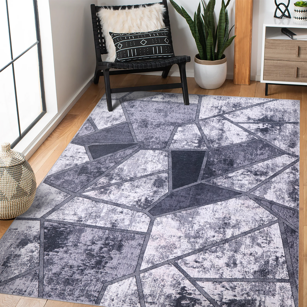 Black and white geometric patchwork washable rug by Netline Home, featuring a modern, bold design for stylish home decor.