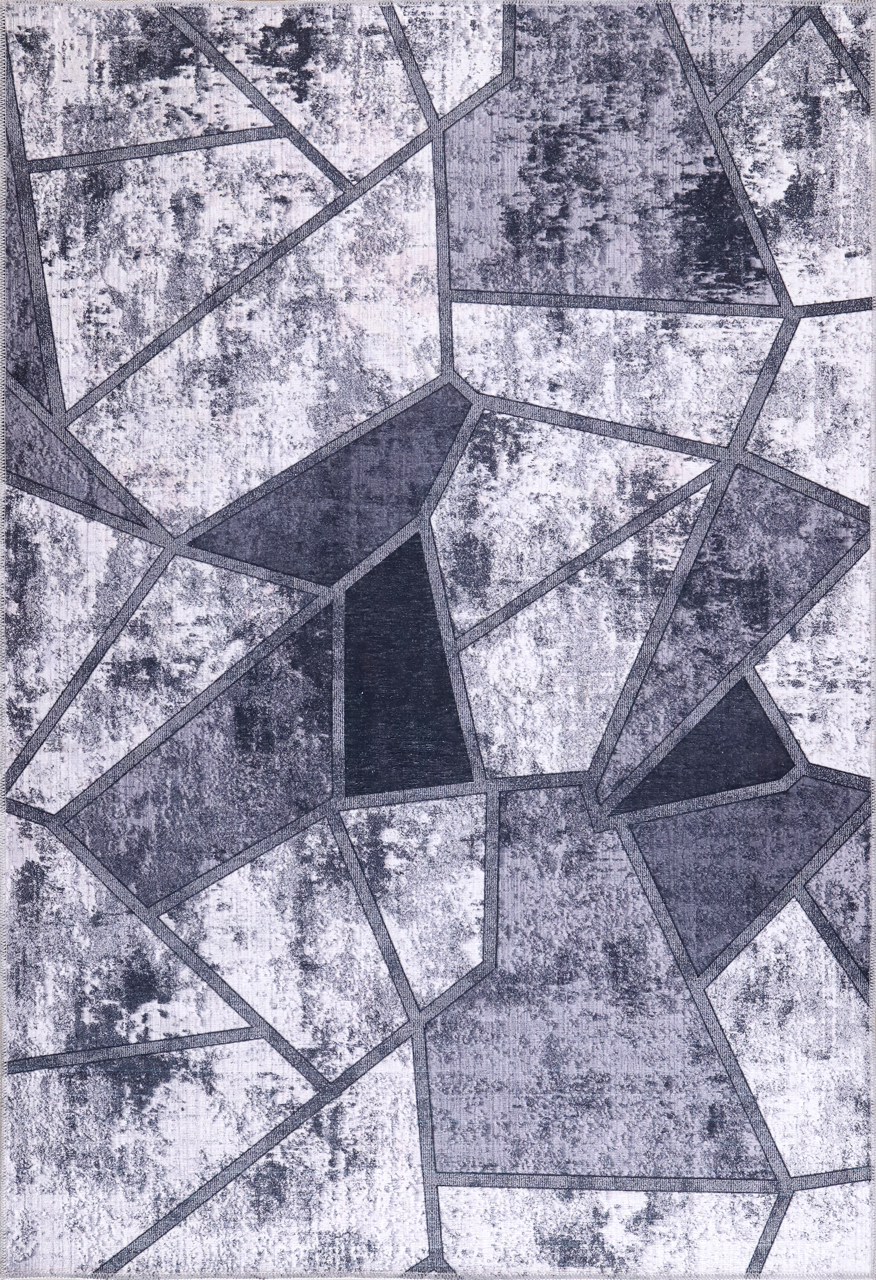 Black and white geometric patchwork washable rug by Netline Home, featuring a modern design with bold shapes and patterns.