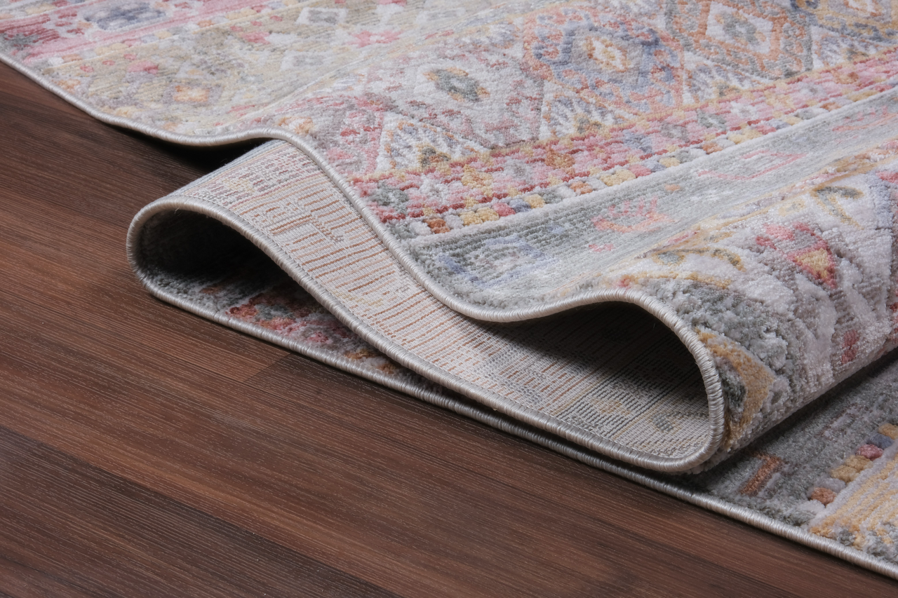 Vintage-style runner rug by Netline Home featuring soft neutral tones and distressed oriental design in grey and rust.