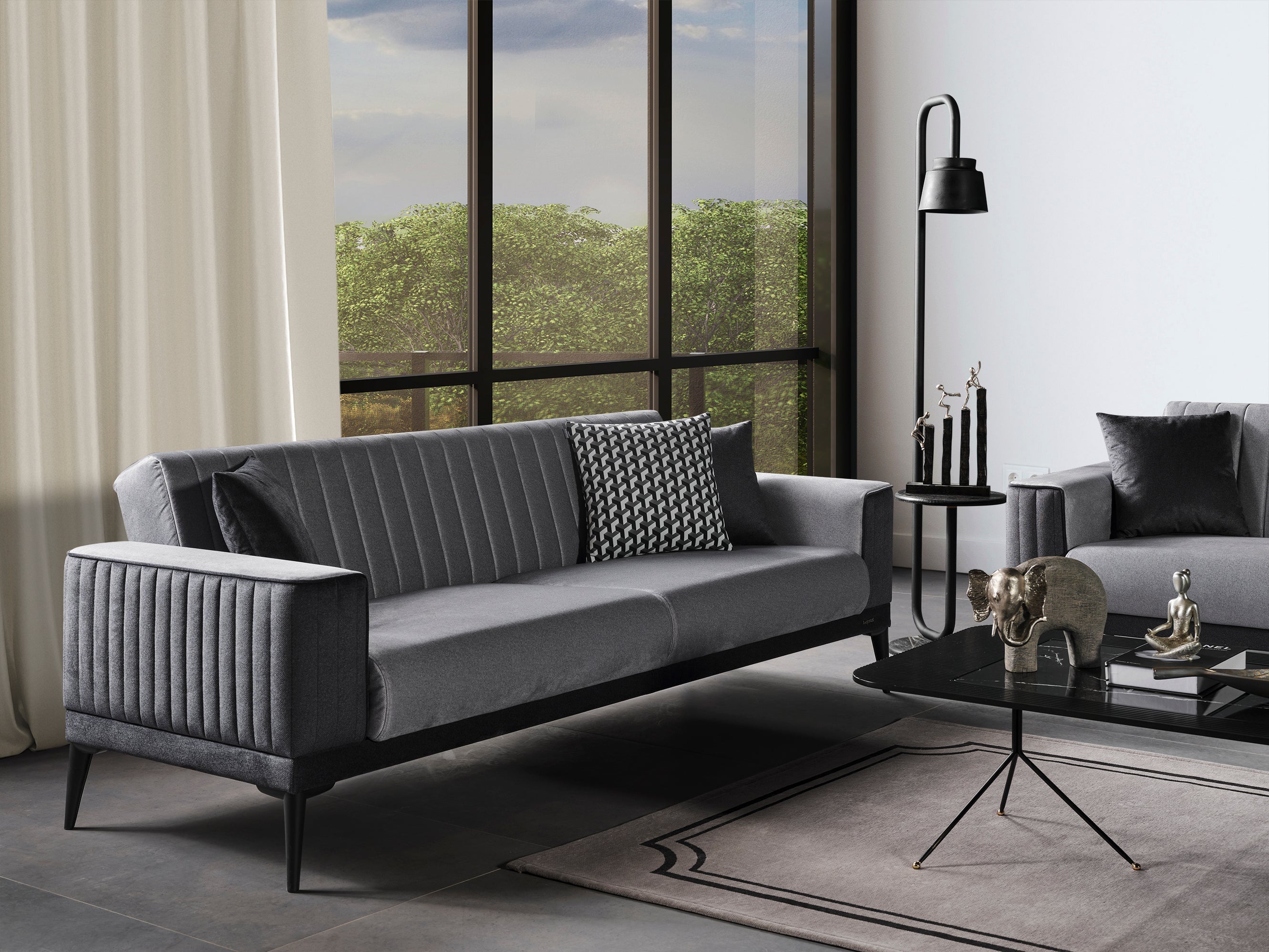 Modern Dama Sofa Set by Netline Home Interior featuring plush cushions and sleek fabric upholstery in a stylish living room setting.