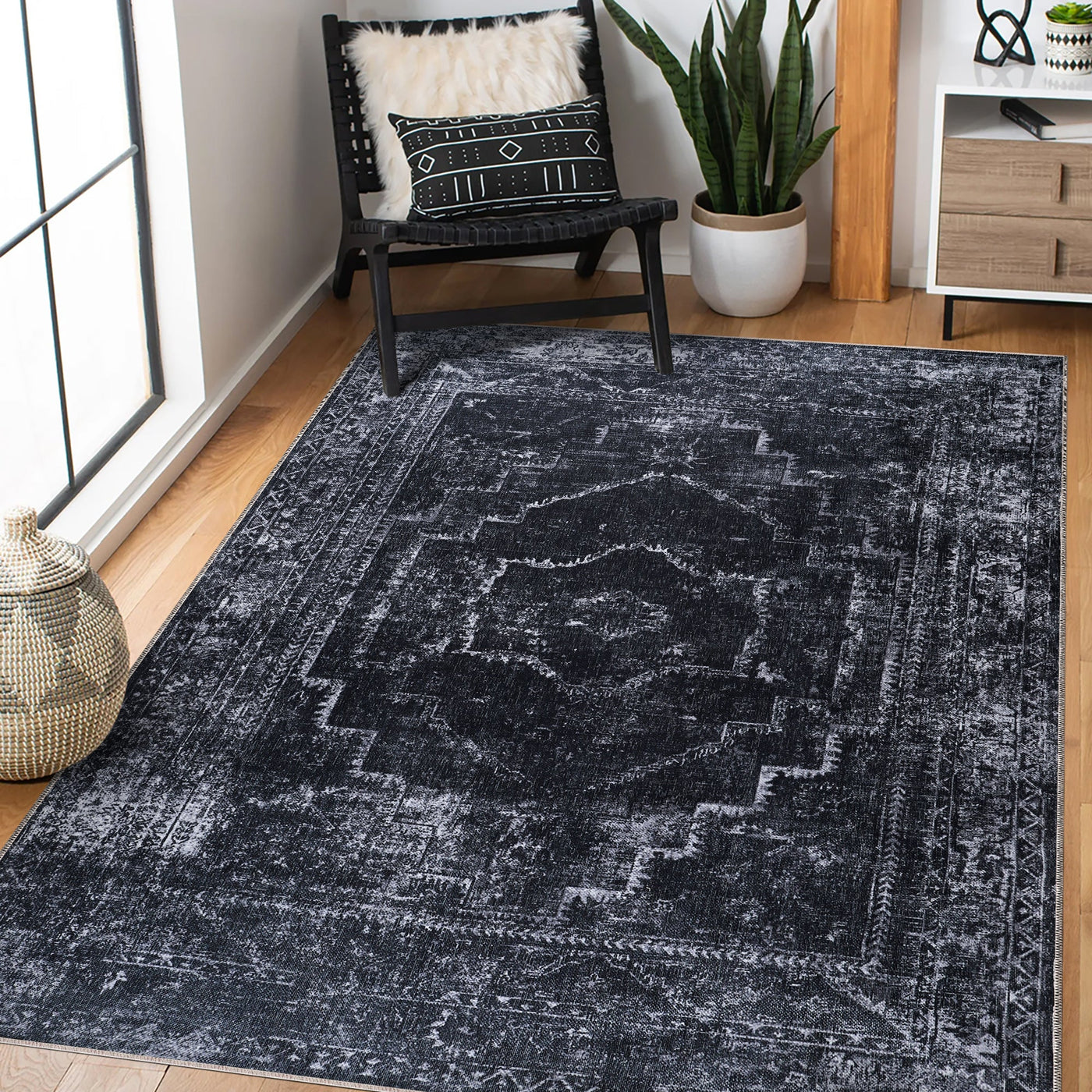 Machine washable black distressed rug by Netline Home with vintage medallion design, ideal for living room, bedroom, or office.