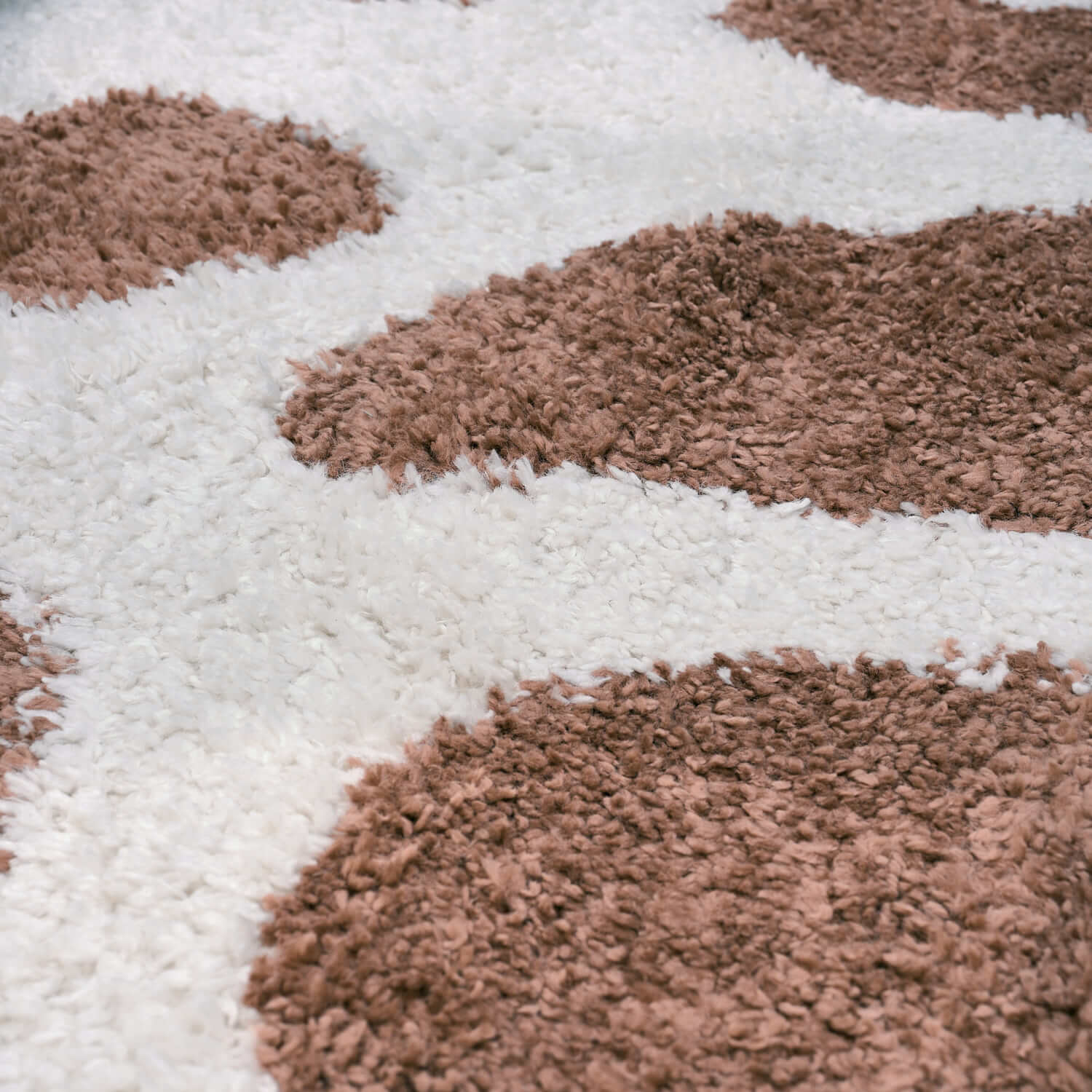 Close-up of Moodi Shaggy Terra Froth Runner Rug by The Rugs, showcasing its soft, textured shaggy surface in earthy terracotta tones.