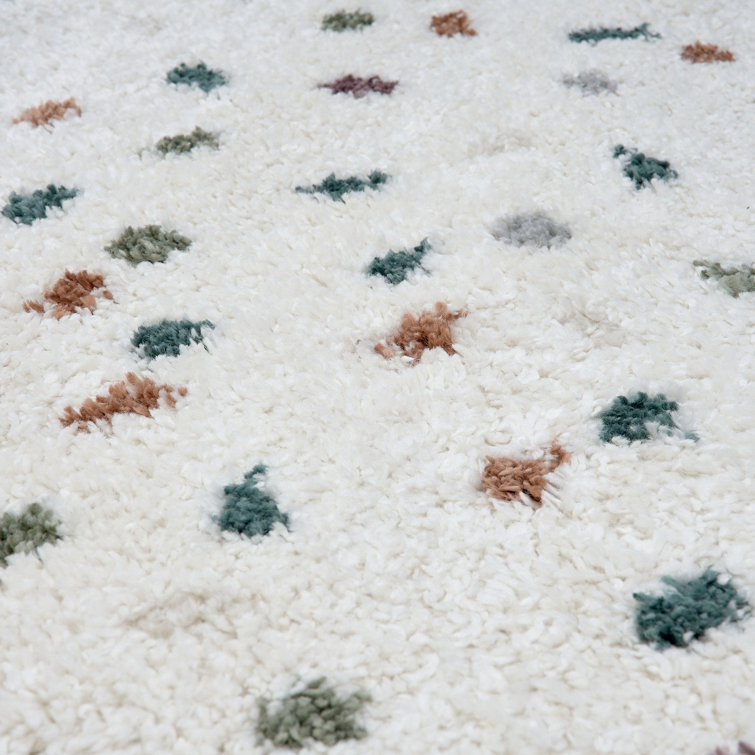 Colorful Moodi Jubile shaggy runner rug from The Rugs with a multicolour pattern and soft, textured pile on a hardwood floor.