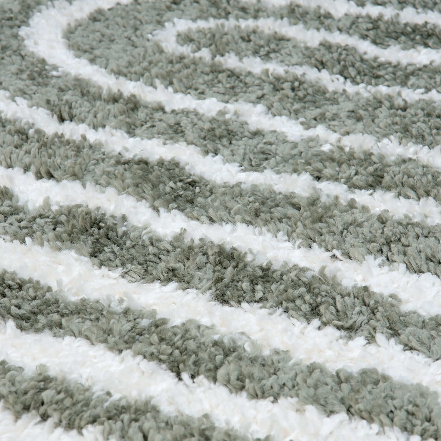 Close-up of the Moodi Shaggy Green Reverie Runner Rug by The Rugs, showcasing its plush, shaggy texture and vibrant green color.