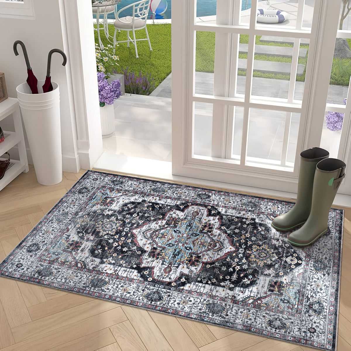 Machine washable Persian medallion rug by Netline Home featuring vintage black and white oriental design with blue accents.