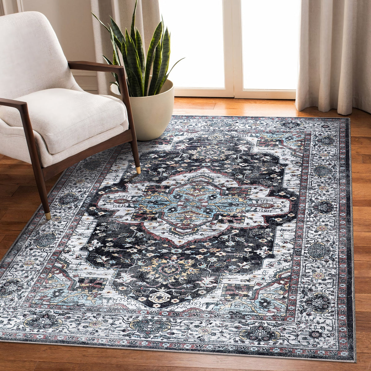 Machine washable Persian medallion rug by Netline Home featuring vintage black, white, and blue accents, ideal for living and dining rooms.