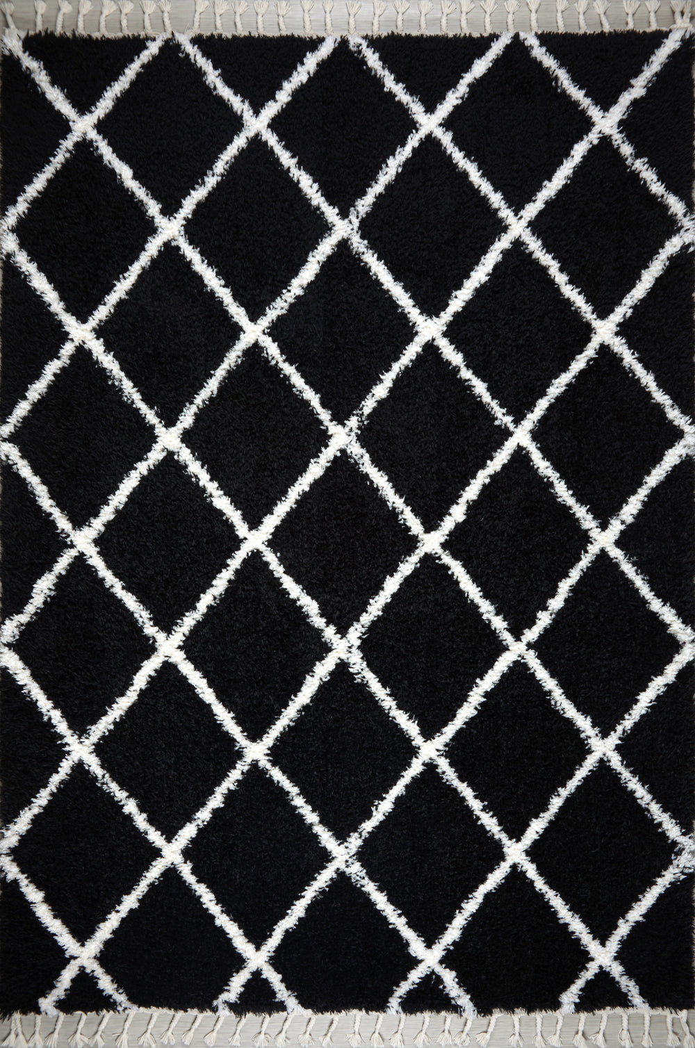Black and white shaggy Moroccan rug with diamond pattern, high pile plush texture, and tassels by Netline Home.