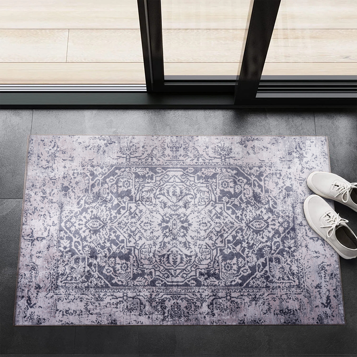 Terrace Patina Mid Blue Vintage Washable Rug shown in an illustrative room