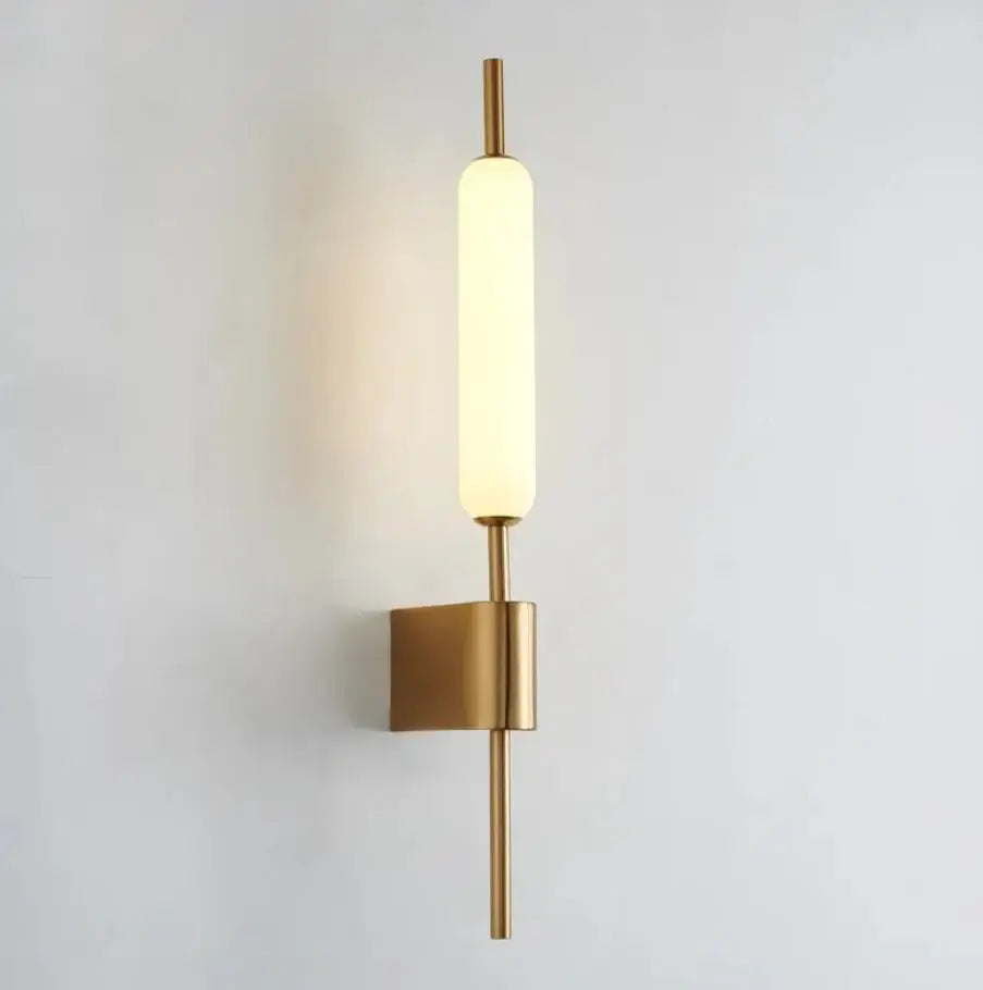 Modern Chiraag Gold Wall Lamp with warm white LED light and acrylic design, providing stylish illumination for interior spaces.