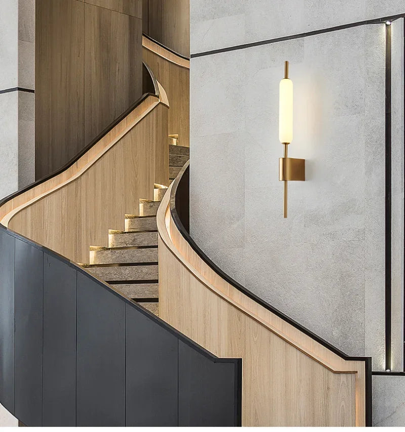 Chiraag Gold Wall Lamp by Light My House with modern acrylic design and warm white LED light on a neutral wall.
