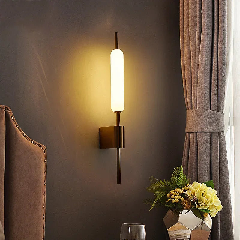 Chiraag Gold Wall Lamp by Light My House with warm white LED light and modern acrylic design mounted on a wall.