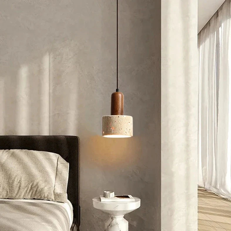 Beige and brown travertine pendant light by Light My House hanging above a kitchen island ceiling fixture.
