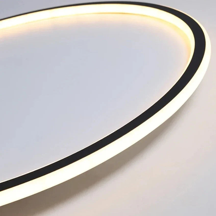 Dimmable LED ring flush mount chandelier by Light My House, black and white ceiling light with modern design and sleek finish.