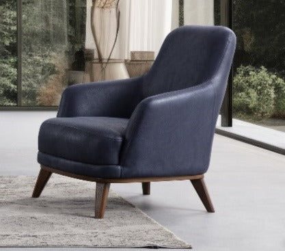 Netline Home Interior Hermes armchair with plush upholstery, stylish accent seating for modern living rooms.