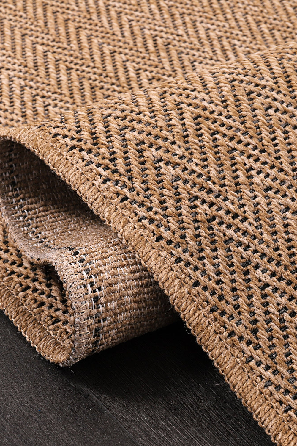Beige herringbone jute effect washable indoor-outdoor rug with non-slip flatweave surface by Netline Home.