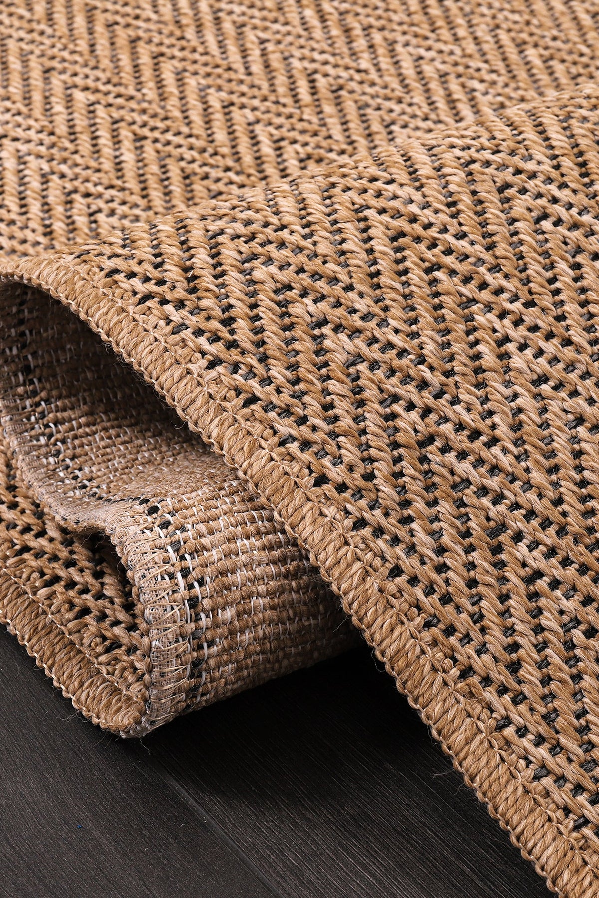 Beige herringbone jute effect washable indoor-outdoor rug with non-slip flatweave surface by Netline Home.