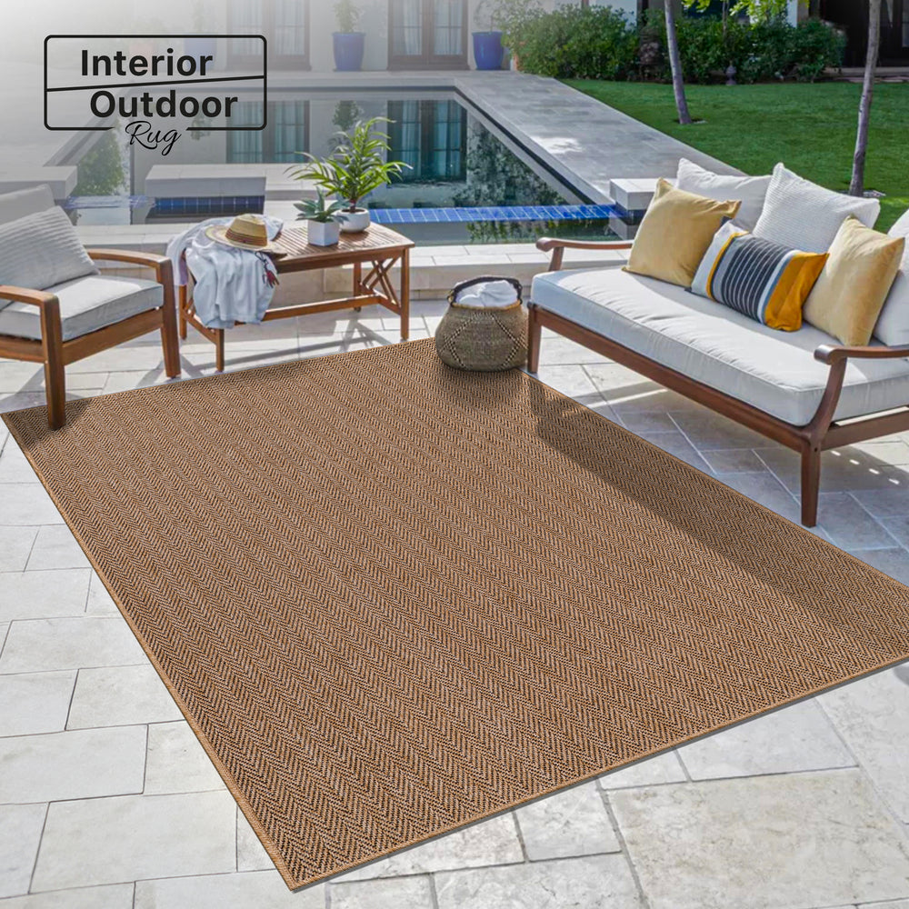 Beige herringbone jute effect washable indoor-outdoor rug by Netline Home with non-slip flatweave surface.
