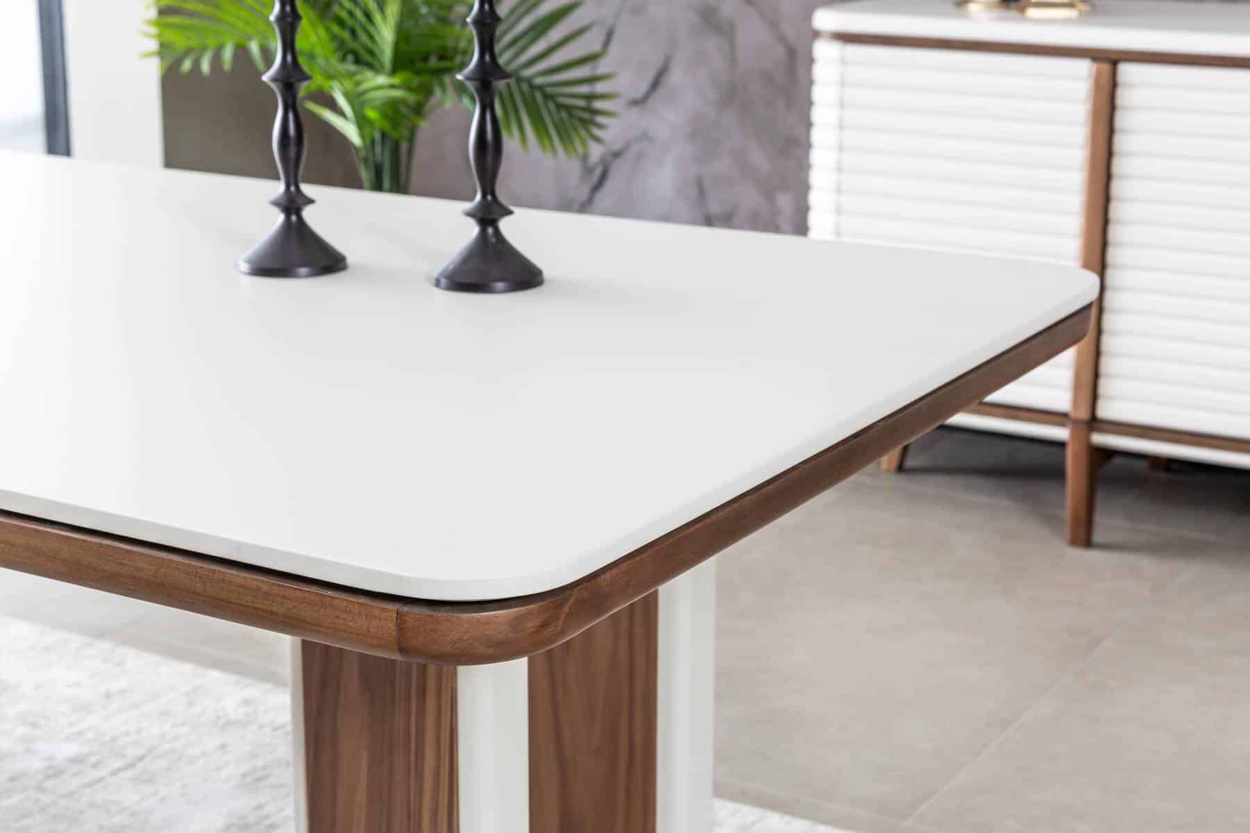 Bentley dining table with matching chairs in a modern family dining room by Netline Home Interior.