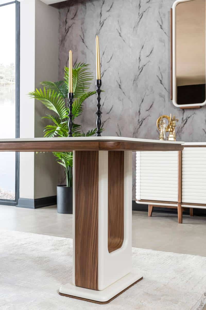 Modern Bentley dining table by Netline Home Interior with a sleek wooden surface and sturdy legs in a contemporary dining room setting.
