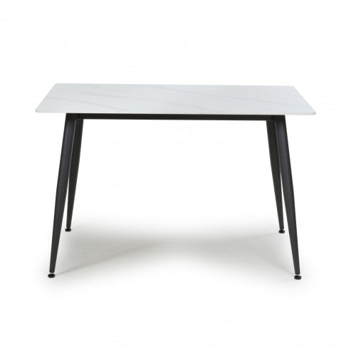 Modern Monaco dining table by Netline Home Interior, showcasing a sleek wooden surface and contemporary design.