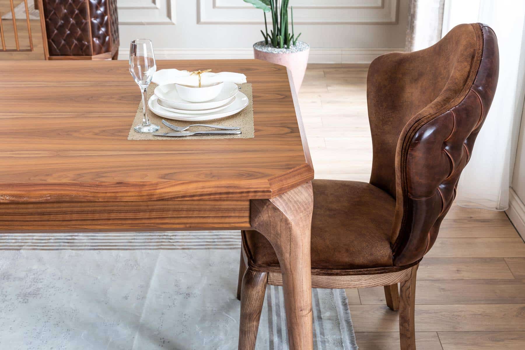 Modern Lotus dining room set by Netline Home Interior featuring a sleek table and matching chairs for stylish entertaining.